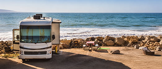 Class A motorhome camping by the ocean